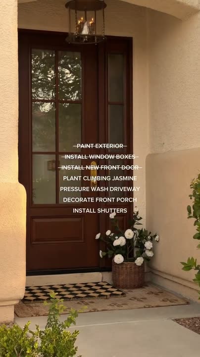 Reel by @mckennabarry: Tall gunstock-stained door with six glass panes and a sidelight, white flowers on the step.